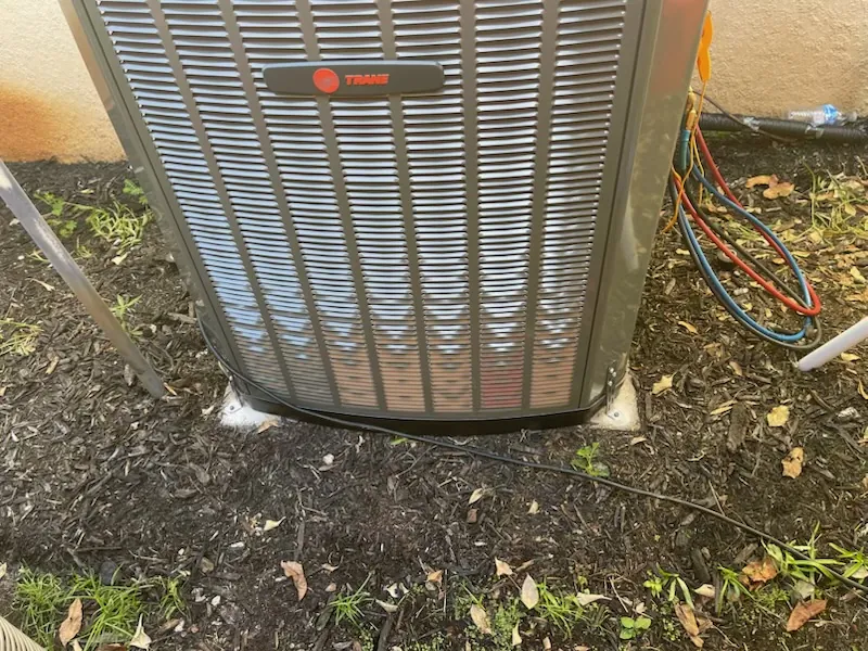 Gauge hoses connected to a new Trane condenser during startup