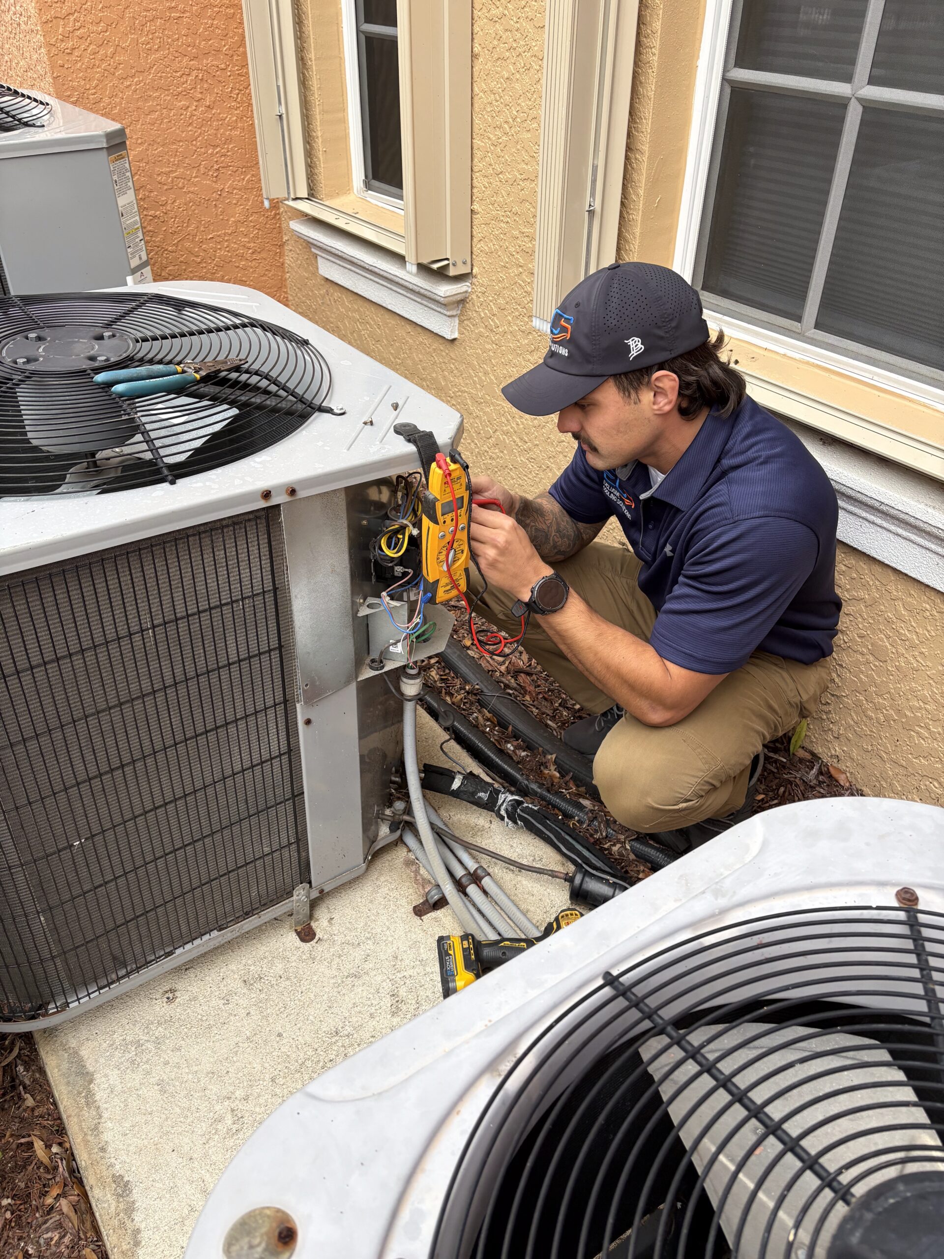Guiseppi La Mura ECS technician performing AC electrical repair Cape Coral FL