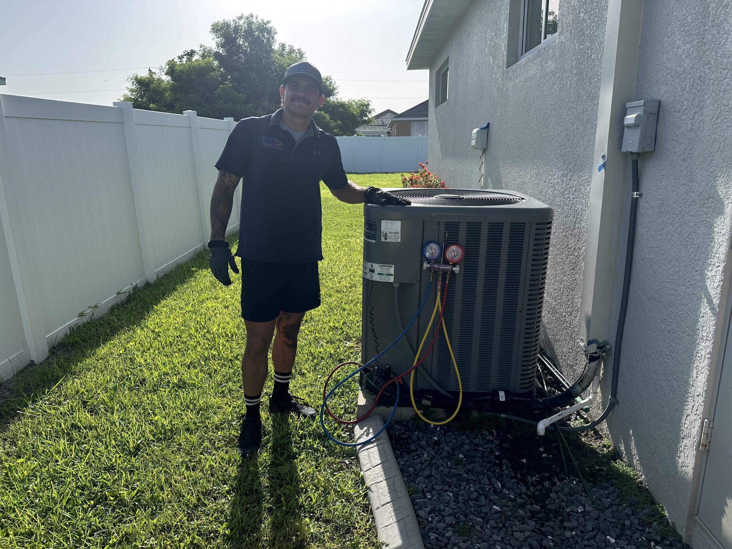 Guiseppi La Mura HVAC technician servicing AC unit Cape Coral FL — Exclusive Cooling Solutions