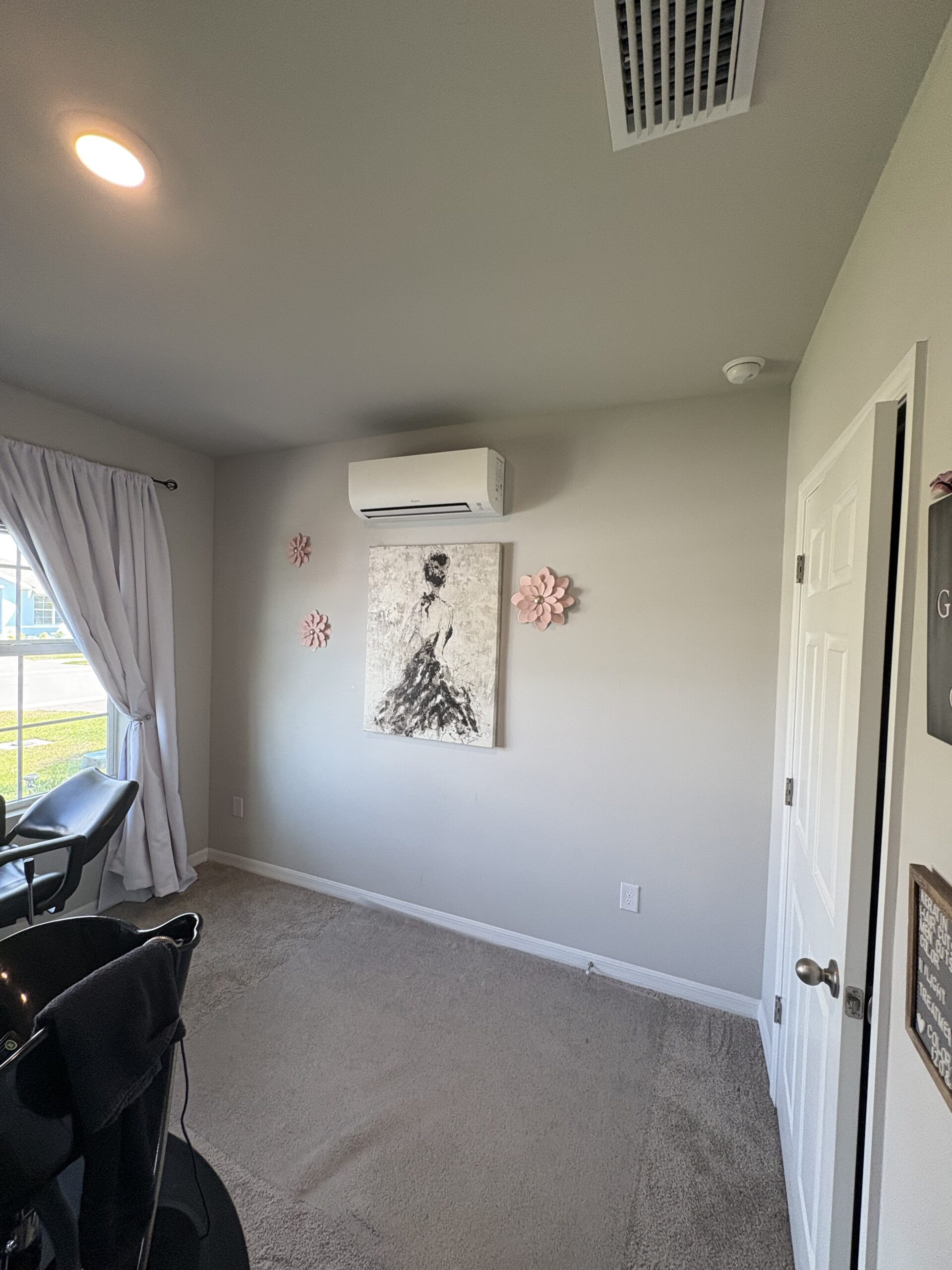 Ductless mini split indoor wall unit installed in Cape Coral FL bedroom — Exclusive Cooling Solutions
