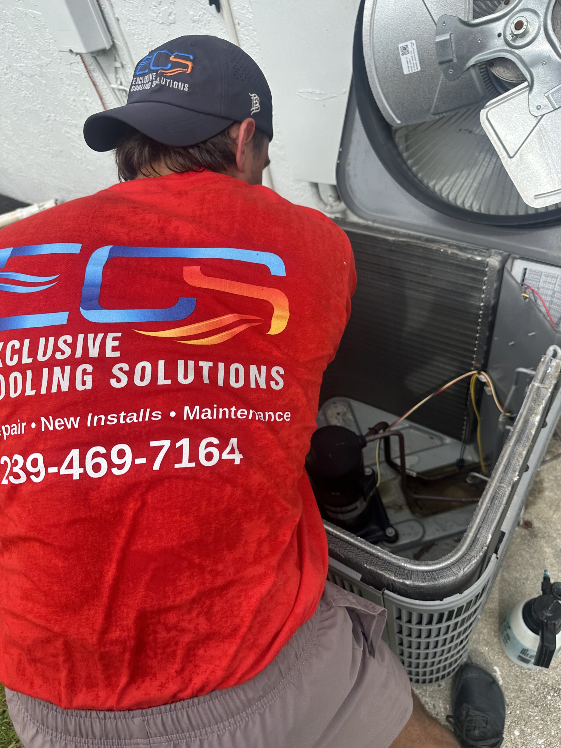 ECS HVAC technician performing AC repair Cape Coral FL — Exclusive Cooling Solutions
